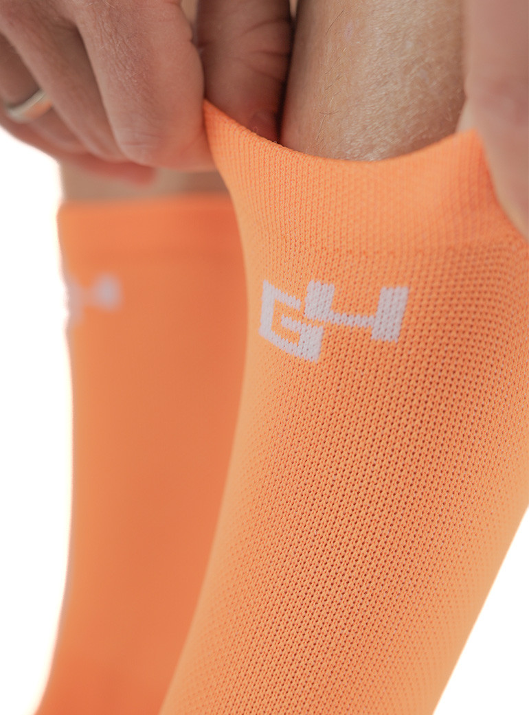 chaussettes de vélo orange fluo